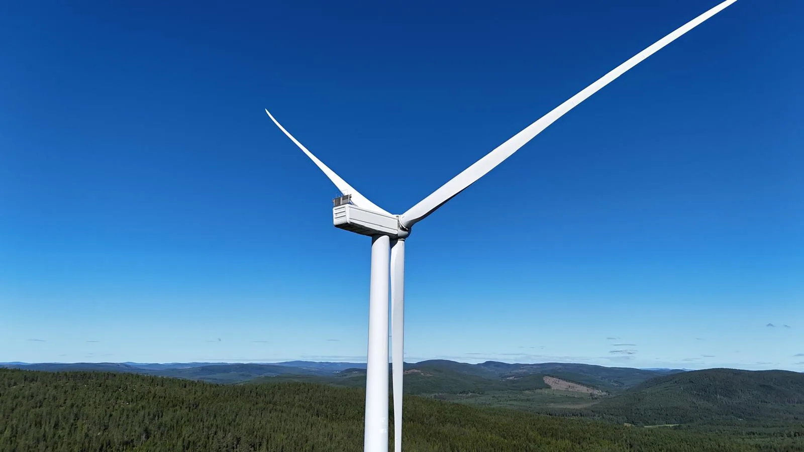 Wind turbine in the Swedish landscape under a blue sky